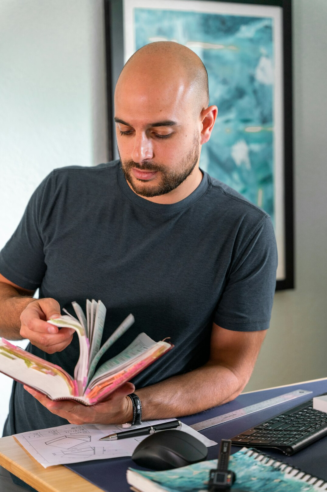 person reading book at desk