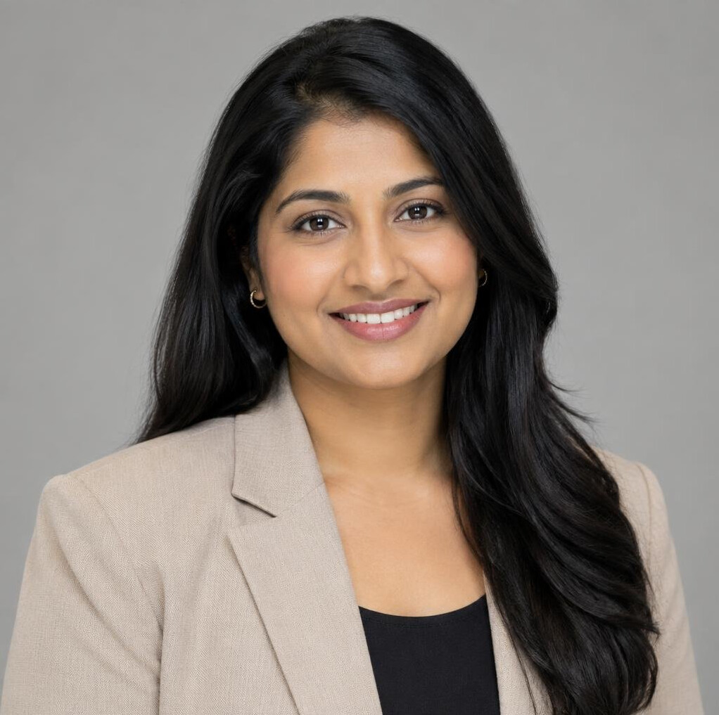 Studio portrait of a woman in her 30s in a blazer