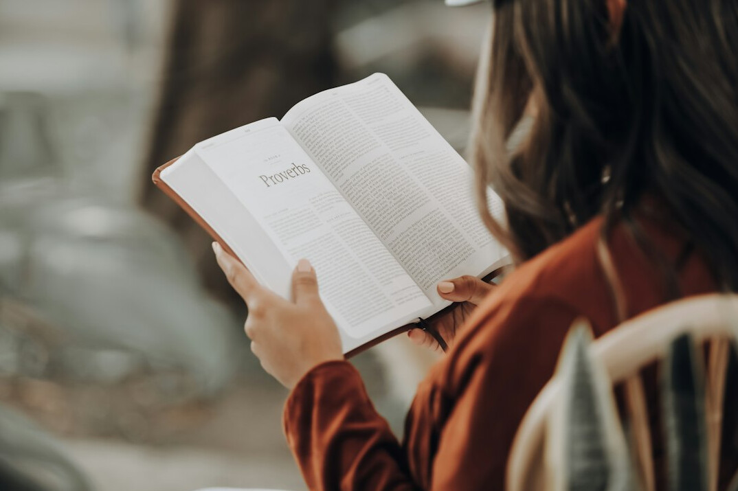 person reading book on career