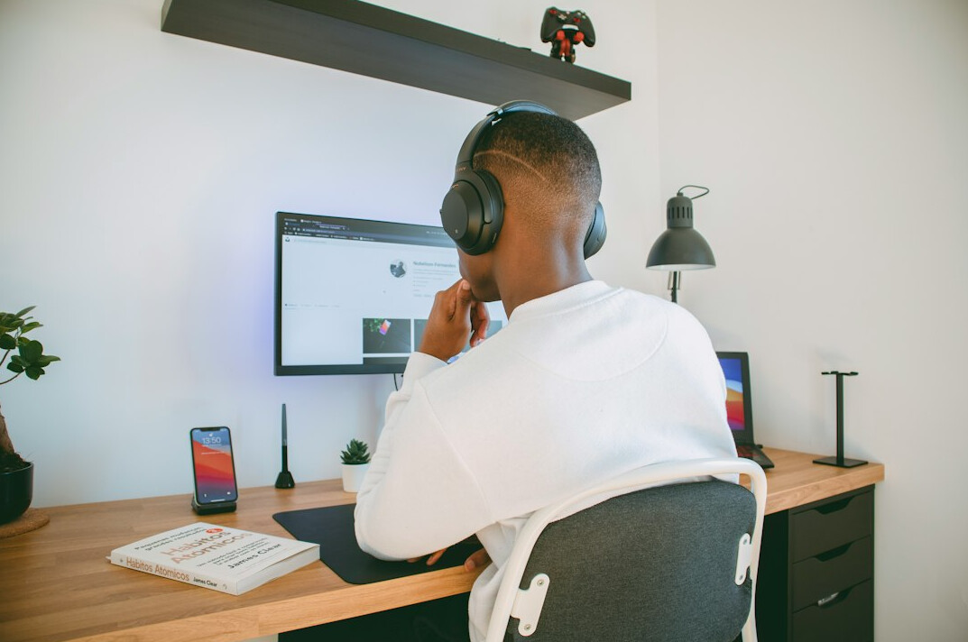 person studying online at desk
