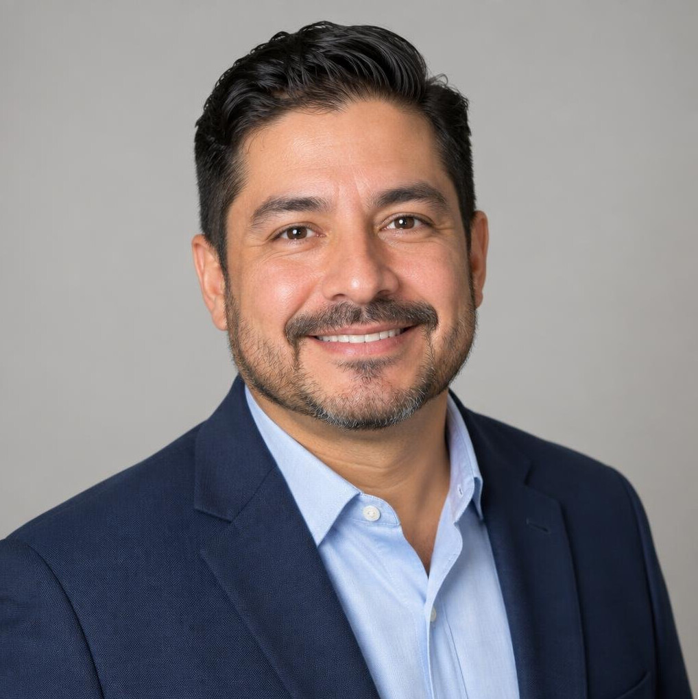 Studio portrait of a man in his 40s in smart casual attire