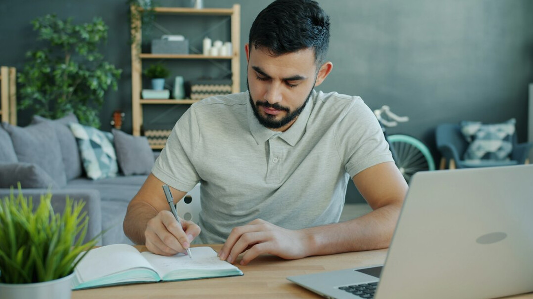 man studying at desk